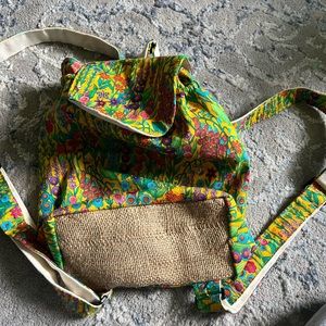 Unique floral and straw knit back pack boutique